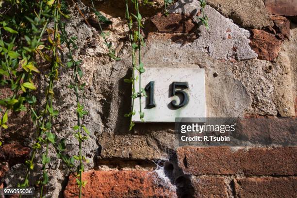 three dimensional house number fifteen 15. black lettering on a white background. - house number stock pictures, royalty-free photos & images