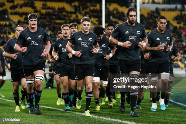 Scott Barrett, Beauden Barrett, Sam Whitelock and Vaea Fifita of New Zealand leave the field after warming up during the International Test match...