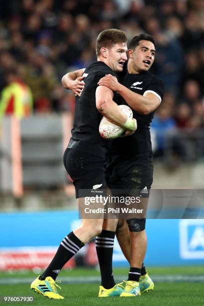 Jordie Barrett of the New Blacks is congratulated on his try by Anton Lienert-Brown during the International Test match between the New Zealand All...