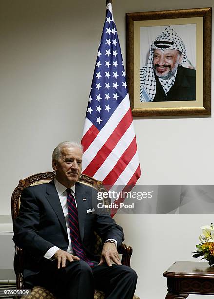 Vice President Joe Biden sits beneath a picture of former Palestianian leader Yasser Arafat a meeting with Palestinian President Mahmoud Abbas at the...