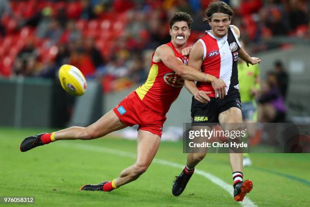 Hunter Clark of the Saints kicks during the round 13 AFL match between the Gold Coast Suns and the St Kilda Saints at Metricon Stadium on June 16,...