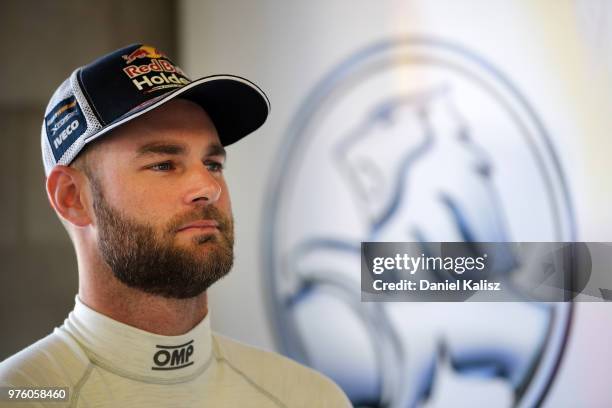 Shane Van Gisbergen driver of the Red Bull Holden Racing Team Holden Commodore ZB looks on during race 15 for the Supercars Darwin Triple Crown at...