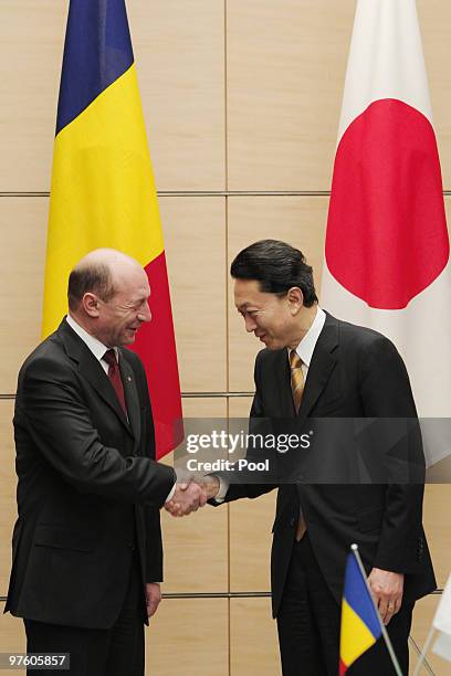 Romanian President Traian Basescu, left, is greeted by Japanese Prime Minister Yukio Hatoyama on March 10, 2010 in Tokyo, Japan.