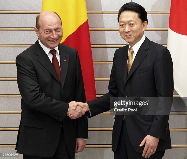 Romanian President Traian Basescu, left, is greeted by Japanese Prime Minister Yukio Hatoyama on March 10, 2010 in Tokyo, Japan.