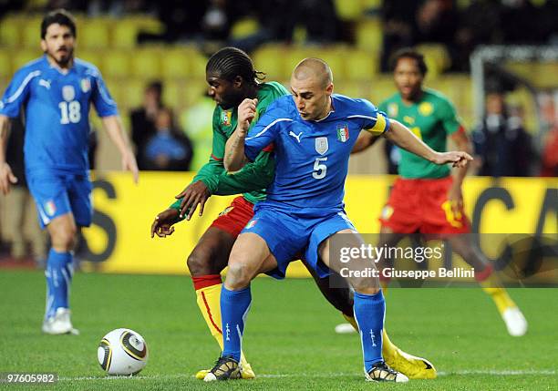 Dorge Kouemaha of Cameroon and Fabio Cannavaro of Italy in action during the International Friendly match between Italy and Cameroon at Louis II...