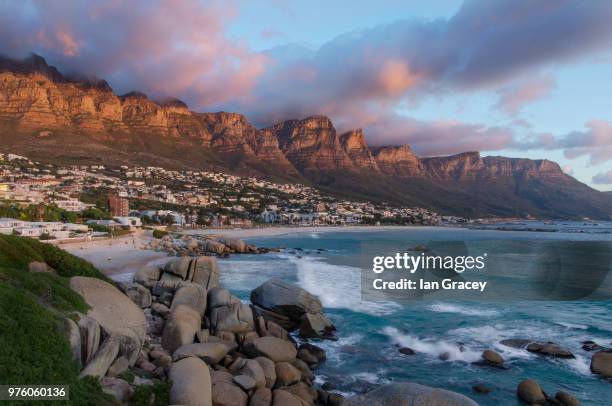 town on coast, camps bay, cape town, south africa - cape town sunset stock pictures, royalty-free photos & images