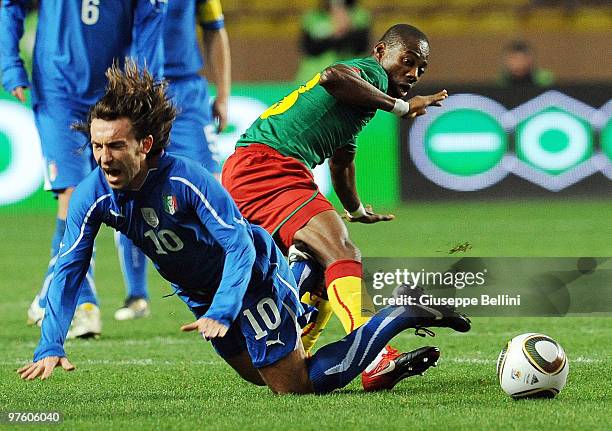 Andrea Pirlo of Italy and Enoh Eyong of Cameroon in action during the International Friendly match between Italy and Cameroon at Louis II Stadium on...