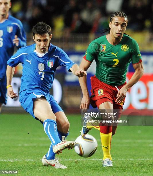 Andrea Cossu of Italy and Benoit Assou Ekotto of Cameroon in action during the International Friendly match between Italy and Cameroon at Louis II...