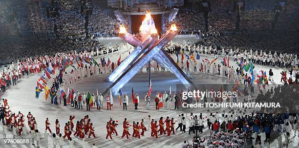 Delegation members march during the closing ceremony at the BC Place in Vancouver, on the last day of the 2010 Winter Olympics on February 28, 2010....