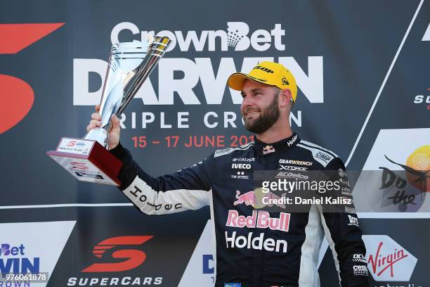 2nd place Shane Van Gisbergen driver of the Red Bull Holden Racing Team Holden Commodore ZB celebrates on the podium during race 15 for the Supercars...