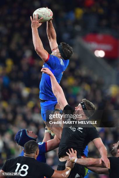 France's Kelian Galletier reaches for the ball with teammate Paul Gabrillagues and New Zealand's Scott Barrett during the second rugby Test match...