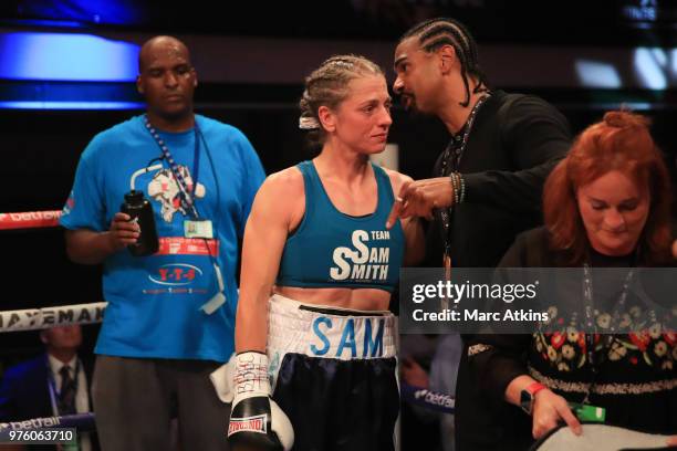 The defeated Sam Smith speaks with promotor David Haye during the Commonwealth Lightweight Title fight between Sam Smith and Anisha Basheel at York...