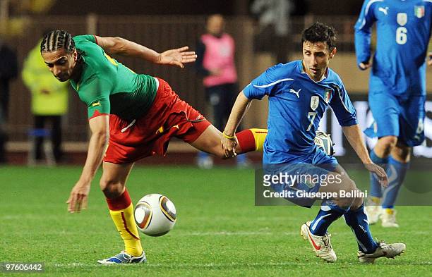 Benoit Assou Ekotto of Cameroon and Andrea Cossu of Italy in action during the International Friendly match between Italy and Cameroon at Louis II...