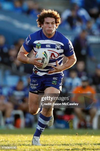 Adam Elliott of the Bulldogs runs the ball during the round 15 NRL match between the Canterbury Bulldogs and the Gold Coast Titans at Belmore Sports...