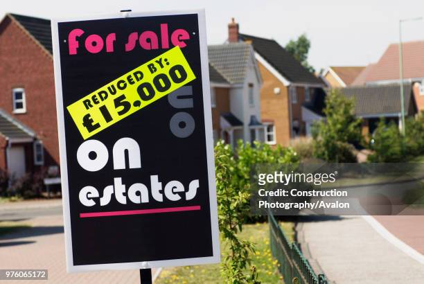 Reduced price property sale sign.
