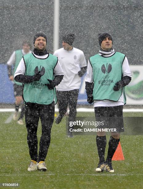 Juventus Brasilian midfielder Diego and defender Fabio Cannavaro warm-up during a training session on the eve of their UEFA Europa League football...