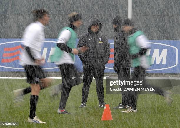 Juventus coach Alberto Zaccheroni looks at his players during a training session on the eve of their UEFA Europa League football round of 16 match...