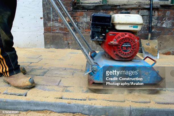 Compactor machine used to levelling cobbled paving stones.