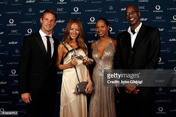 Driver Jenson Button and his girlfriend Jessica Michibata posing with his award for "Laureus Breakthrough of the Year" with Laureus Sports Academy...