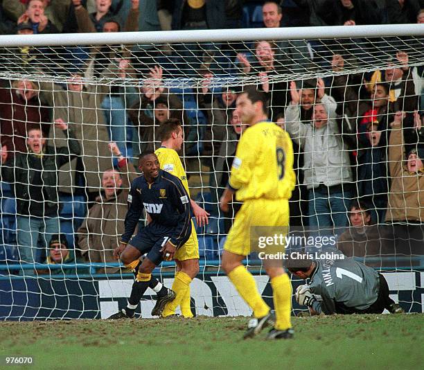 Jason Euell of Wimbledon turns to celebrate after scoring during the Nationwide Division One match between Wimbledon and Queens Park Rangers at...