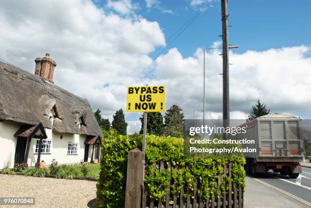Road bypass' campaign signs in a village on the A140 route between Ipswich and Norwich, Suffolk, UK.