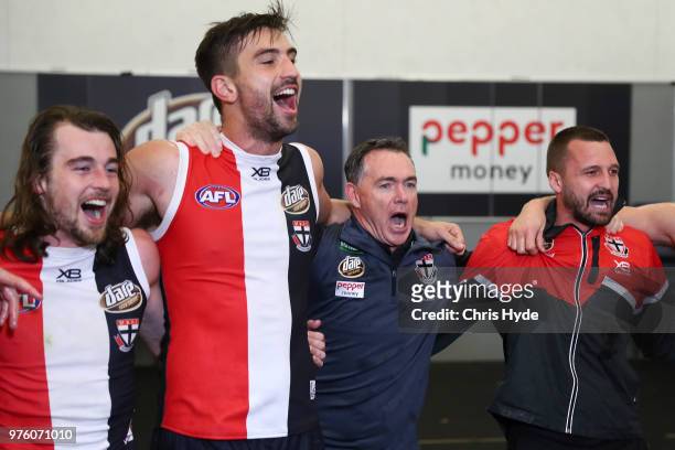Saints coach Alan Richardson celebrates with players after winning the round 13 AFL match between the Gold Coast Suns and the St Kilda Saints at...