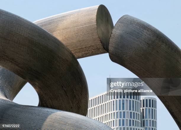 May 2018, Germany, Berlin: The top of the hotel 'Motel One Upper West' between the pillars of the sculpture 'Berlin' by Brigitte and Marting...