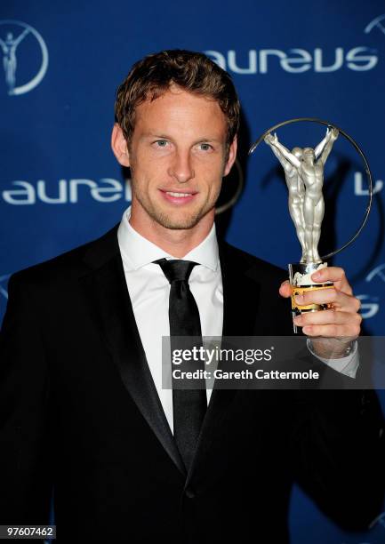 Driver Jenson Button poses with his award for "Laureus Breakthrough of the Year" in the Awards room during the Laureus World Sports Awards 2010 at...