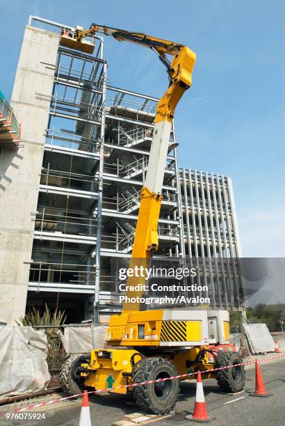 Platform lift in operation at a construction site of a Sainsbury's store, High Wycombe, UK.