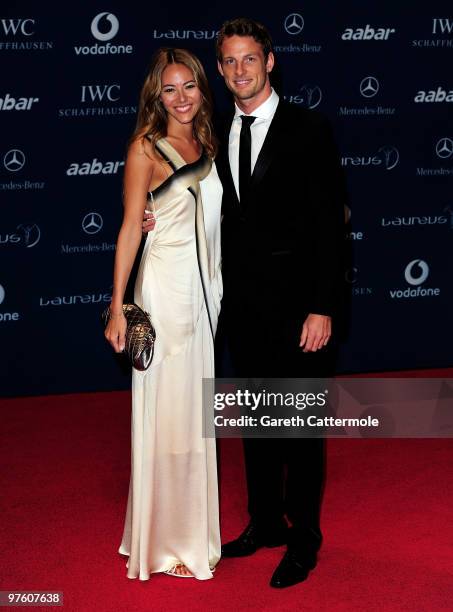 Driver Jenson Button and his girlfriend Jessica Michibata arrive at the Laureus World Sports Awards 2010 at Emirates Palace Hotel on March 10, 2010...