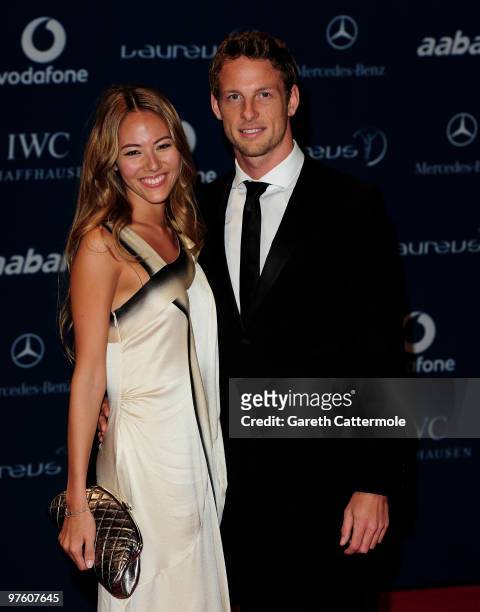 Driver Jenson Button and his girlfriend Jessica Michibata arrive at the Laureus World Sports Awards 2010 at Emirates Palace Hotel on March 10, 2010...