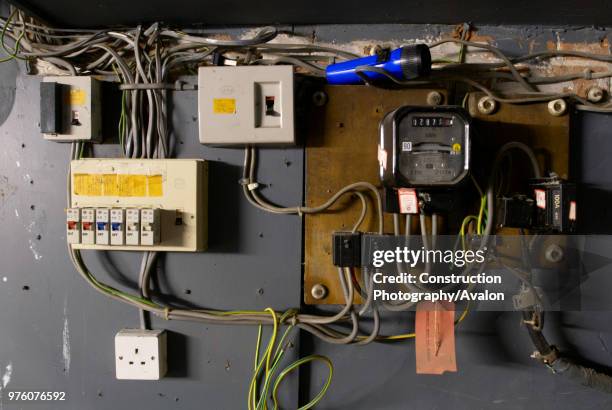 Old electrical installation with switch box, meter and fuse box.