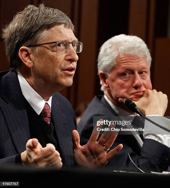 Bill Gates, co-founder and co-chair of the Bill & Melinda Gates Foundation, and former U.S. President Bill Clinton testify before the Senate Foregin...