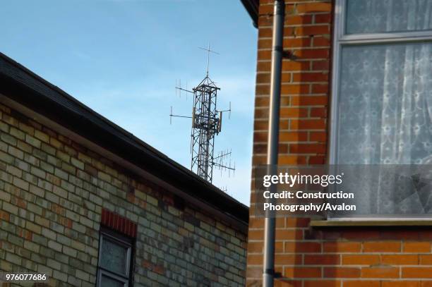 Mobile phone mast near dwellings England, UK.