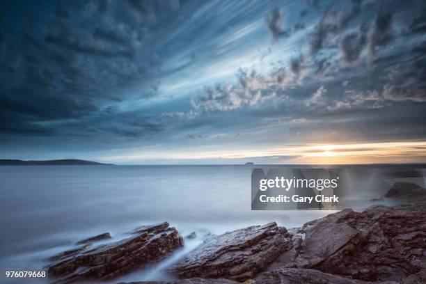 mist surrounding rocks in sea at sunset, weston super mare - an evening with gary clark jr stock pictures, royalty-free photos & images