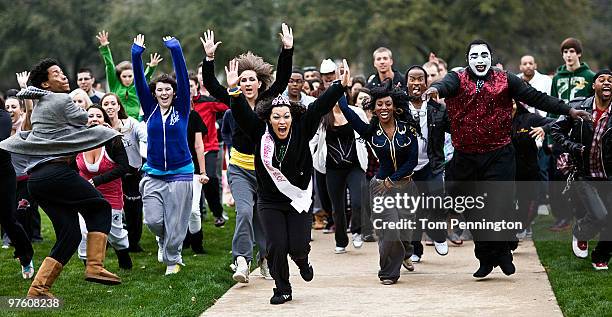 Participants scramble for a chance to be on a local newscast while waiting in line for Fox's "So You Think You Can Dance" Season 7 Auditions March...