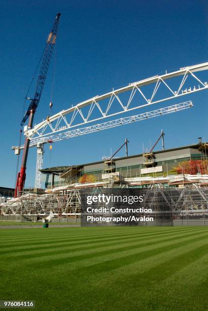Crane lifting roof truss on to Centre Court, All England Lawn Tennis Club, Wimbledon, London, UK, 2008.