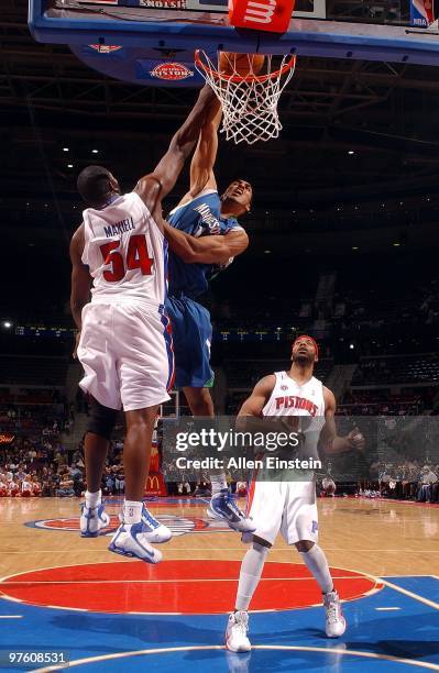 Ryan Hollins of the Minnesota Timberwolves goes to the basket against Jason Maxiell of the Detroit Pistons during the game on February 16, 2010 at...