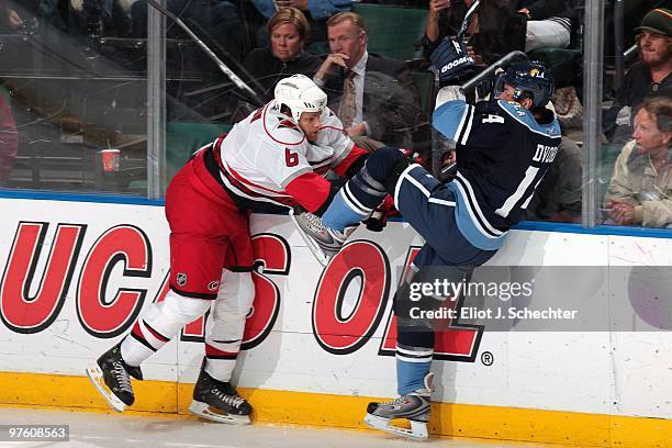 Radek Dvorak of the Florida Panthers tangles with Tim Gleason of the Carolina Hurricanes at the BankAtlantic Center on March 6, 2010 in Sunrise,...