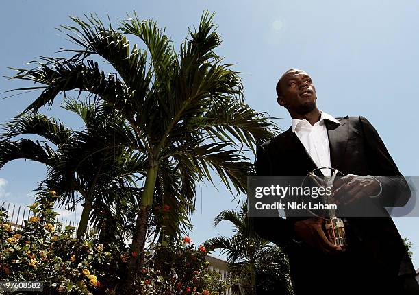 Usain Bolt poses with his Laureus World Sportsman of the Year Award in Kingston, Jamaica for the Laureus World Sports Awards 2010 held at Emirates...