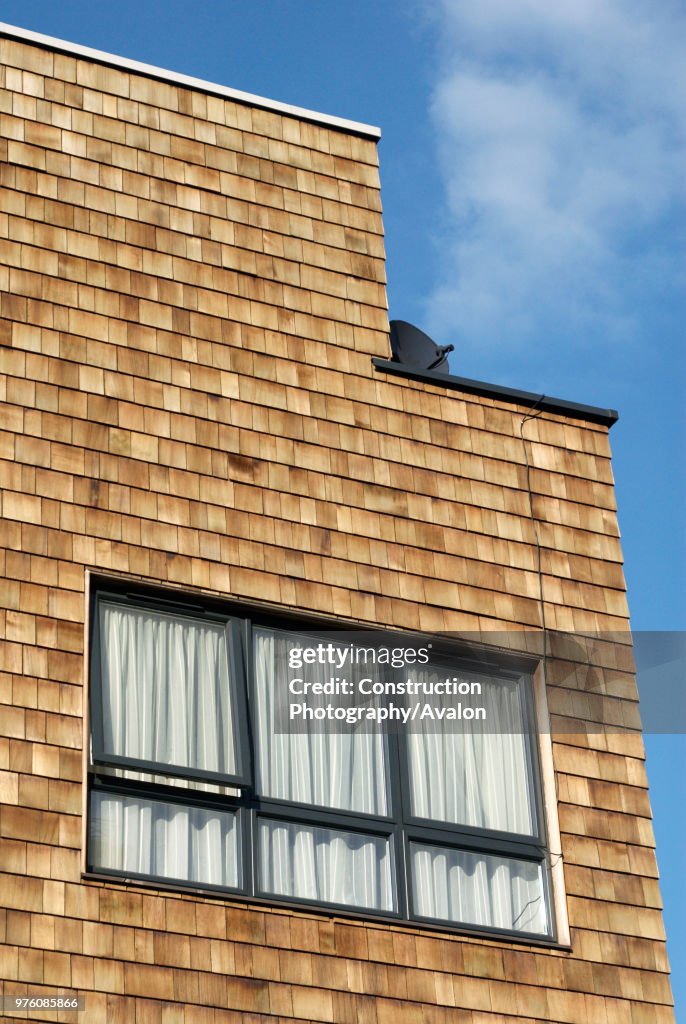 Shingles Form Cladding Cedar shingle cladding on a modern mixed-use development, London, UK ...