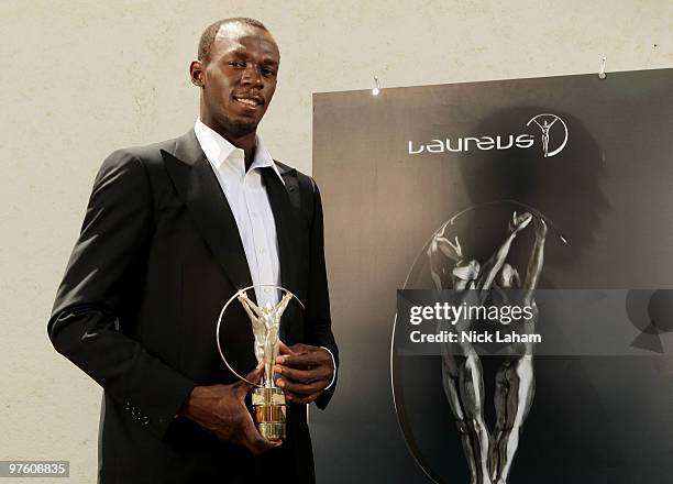 Usain Bolt poses with his Laureus World Sportsman of the Year Award in Kingston, Jamaica for the Laureus World Sports Awards 2010 held at Emirates...