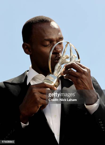 Usain Bolt poses with his Laureus World Sportsman of the Year Award in Kingston, Jamaica for the Laureus World Sports Awards 2010 held at Emirates...