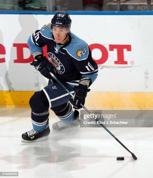 David Booth of the Florida Panthers skates with the puck against the Carolina Hurricanes at the BankAtlantic Center on March 6, 2010 in Sunrise,...