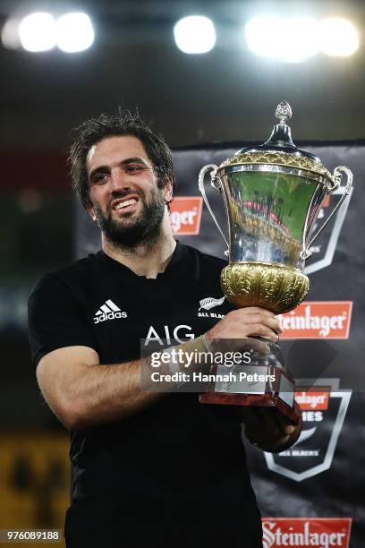 Samuel Whitelock of the All Blacks holds the David Gallegher trophy after winning the International Test match between the New Zealand All Blacks and...