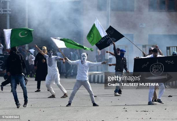 Kashmiri youths waves Pakistan national flags and Islamic State group flags during clashes between protesters and Indian government forces in...