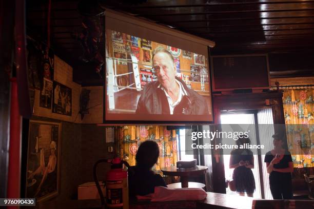 May 2018, Germany, Dusseldorf: A film from the artist Pola Sieverding being shown in the former pub 'Beim Box-Papst'. From the 2 June to the 19...