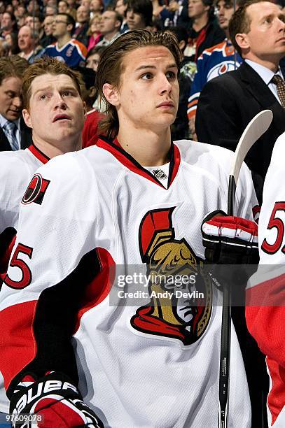 Erik Karlsson of the Ottawa Senators stands for the anthem before a game against the Edmonton Oilers at Rexall Place on March 9, 2010 in Edmonton,...