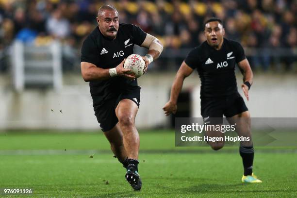 Karl TuÕinukuafe of New Zealand makes a break with Ngani Laumape in support during the International Test match between the New Zealand All Blacks...