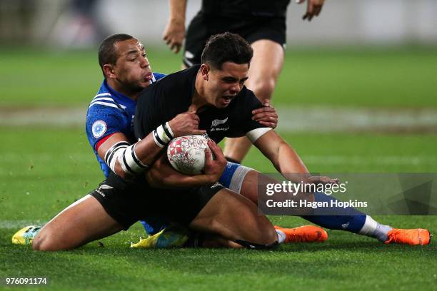 Anton Lienert-Brown of New Zealand is tackled by Gael Fickou of France during the International Test match between the New Zealand All Blacks and...